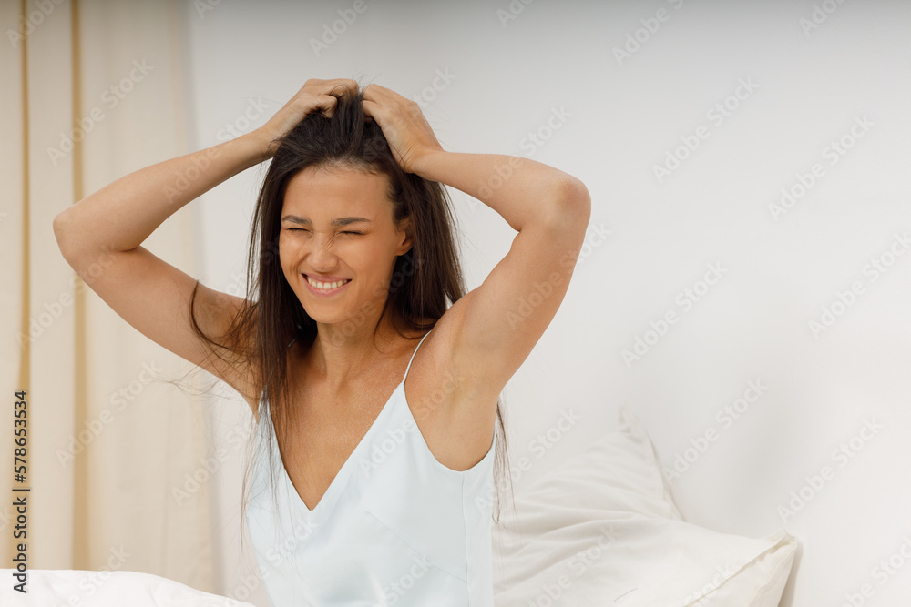 Healthy young woman dressing nightie lying on bed in bedroom. Healthy young woman dressing nightie lying on bed in bedroom.