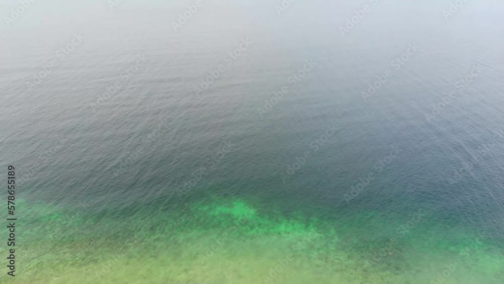 Aerial view of turquoise sea water nearby a beautiful island Aerial view of turquoise sea water nearby a beautiful island