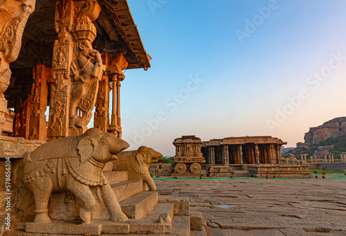 Vijaya Vitthala temple in Hampi with stone charriot in the background photo
