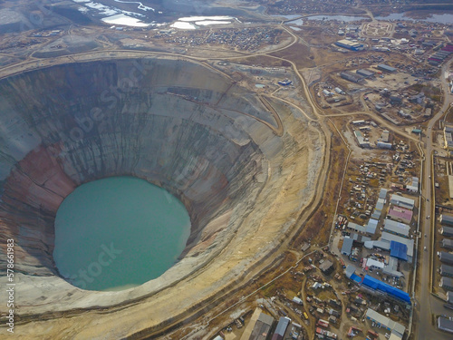 Aerial view of large open pit diamond quarry.