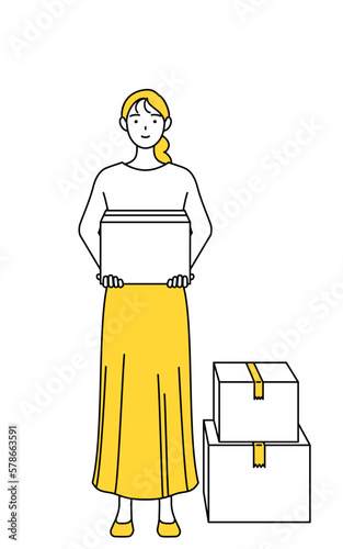 段ボールを運ぶ作業をするカジュアルな格好をした若い女性