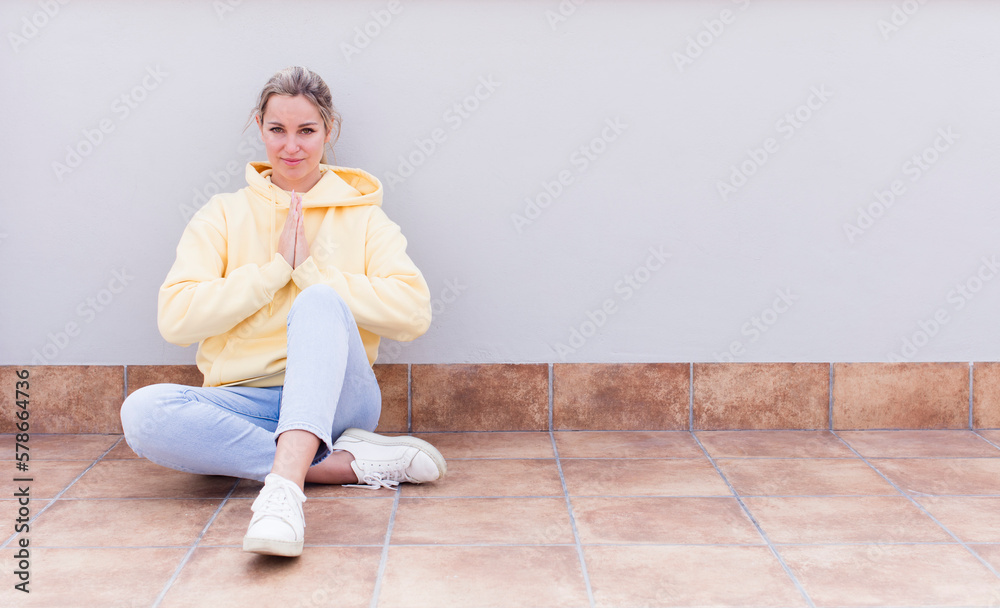 pretty caucasian sitting woman feeling worried, hopeful and religious, praying faithfully with palms pressed, begging forgiveness pretty caucasian sitting woman feeling worried, hopeful and religious, praying faithfully with palms pressed, begging forgiveness
