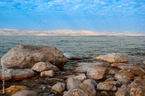 Coastline of Dead Sea against a blurred background of opposite Israeli coast. © MarinoDenisenko