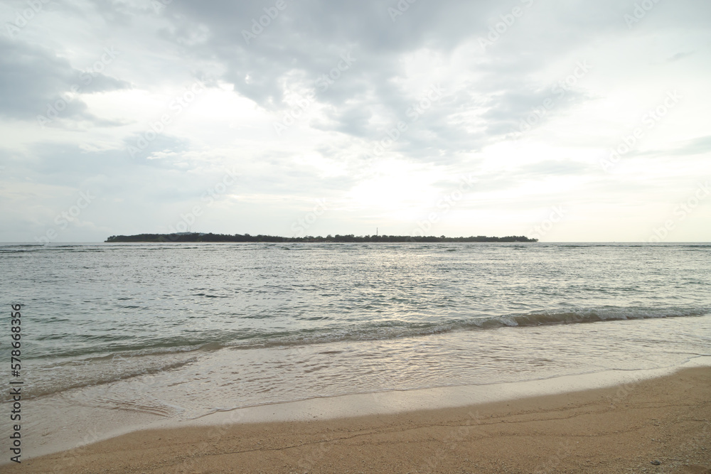 Lombok and Gili Air islands, overcast, cloudy day, sky and sea. Sunset, sand beach. - obrazy, fototapety, plakaty 