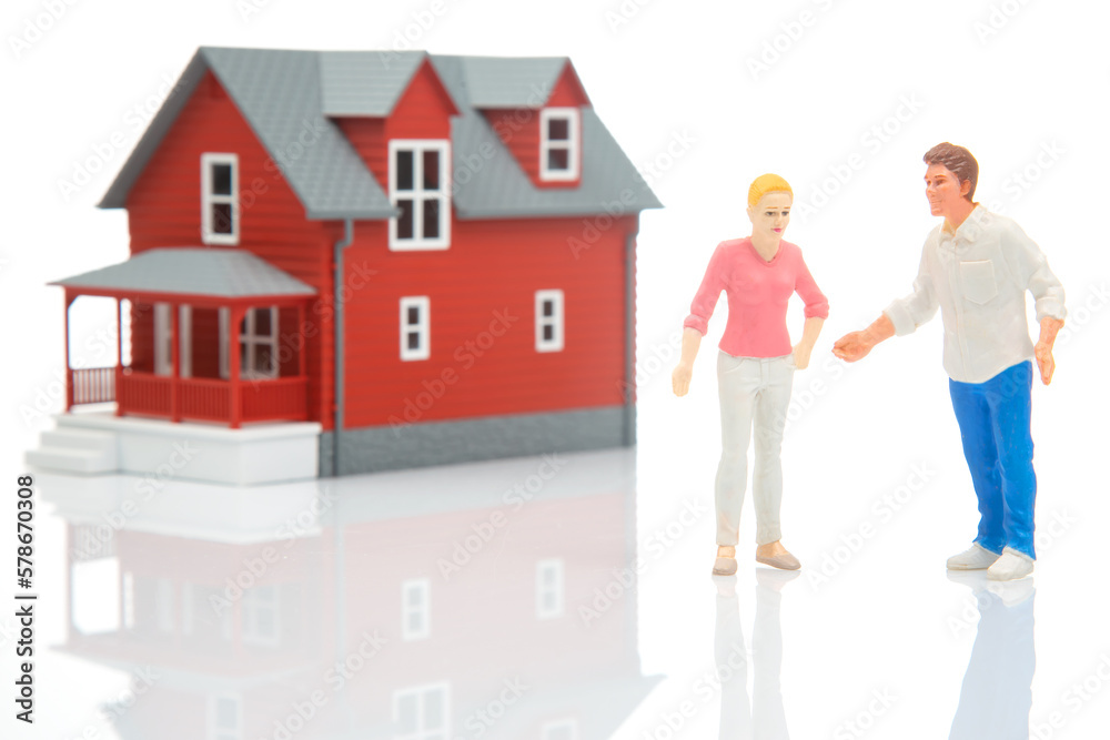 miniature people. figures of man and woman house model on white background. communication and relationship building. problems in communication.
