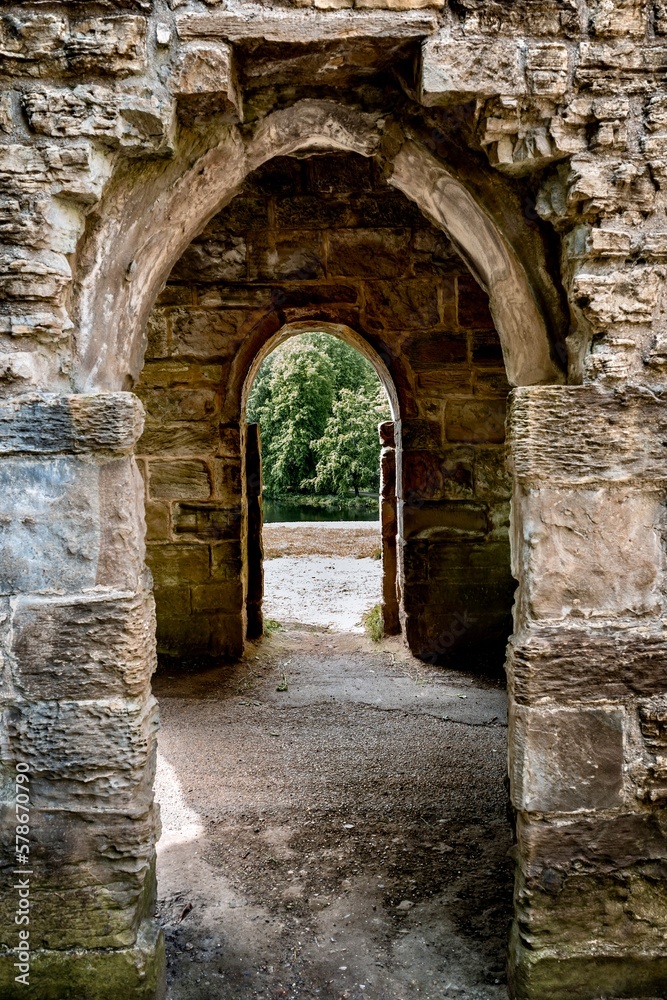 Stone archway in woodland at Hardwick Country Park, Sedgefield, England