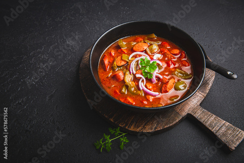 Traditional Solyanka soup - thick and sour soup of Russian origin photo