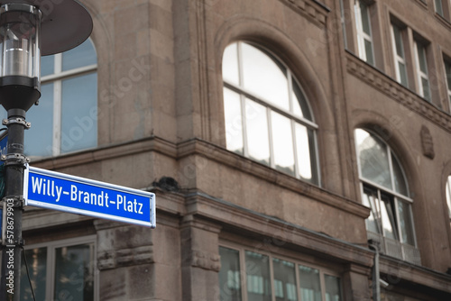 Selective blur on a street sign indicating heinrich Willy Brandt Platz square, one of the main squares of Essen city center dedicated to willy brandt, former social democrat chancellor of germany. photo