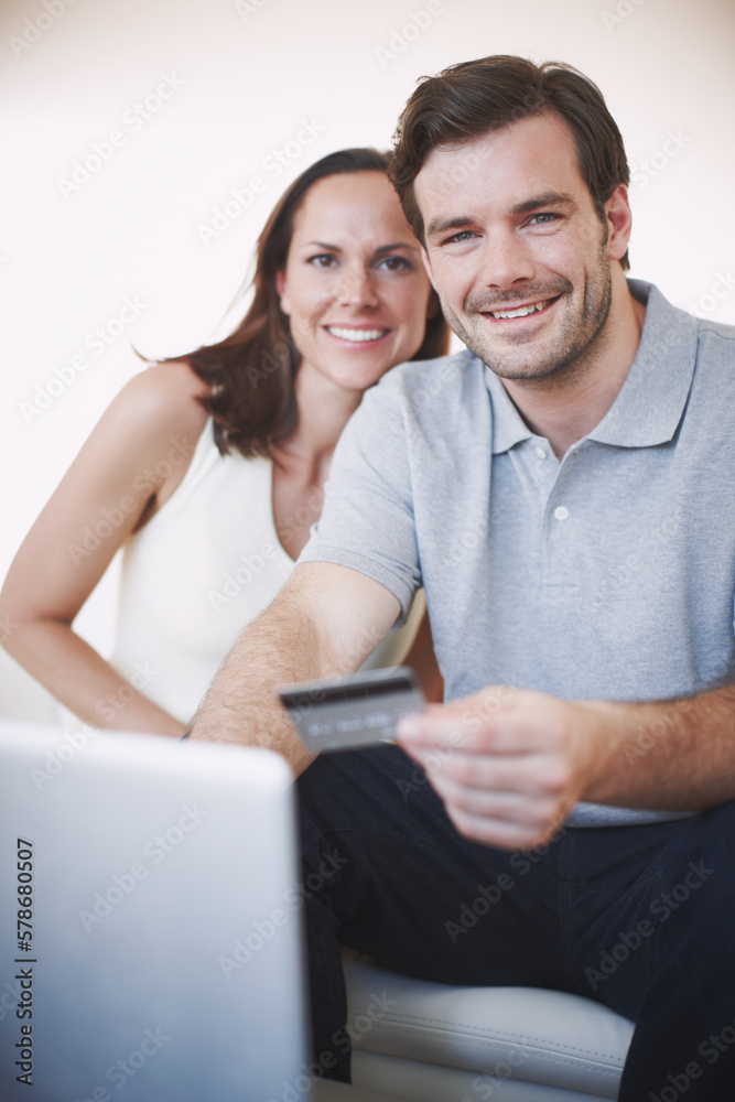 Their finances are in good shape. Portrait of a young couple doing their banking online. Their finances are in good shape. Portrait of a young couple doing their banking online.