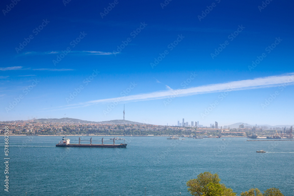 Panorama of Haydarpasa port with its cargo terminal and a supertanker ship, a large boat, sailing on the bosphorus strait in Istanbul, Turkey, passing from Mediterranean to the black sea.