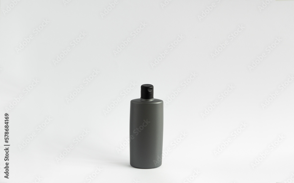 Black shampoo packaging mockup. Vertical empty plastic cosmetic package for man, isolated on white background. Container of conditioner, hair rinse. Black shampoo packaging mockup. Vertical empty plastic cosmetic package for man, isolated on white background. Container of conditioner, hair rinse.