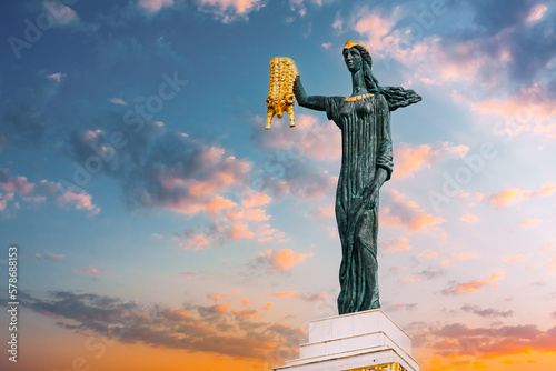 Batumi, Adjara, Georgia. Statue Of Medea On sunset sunrise Sky Background In Europe Square. Woman Holding Golden Fleece. In Greek Mythology, Medea Was Daughter Of King Aeetes Of Colchis And Wife To photo