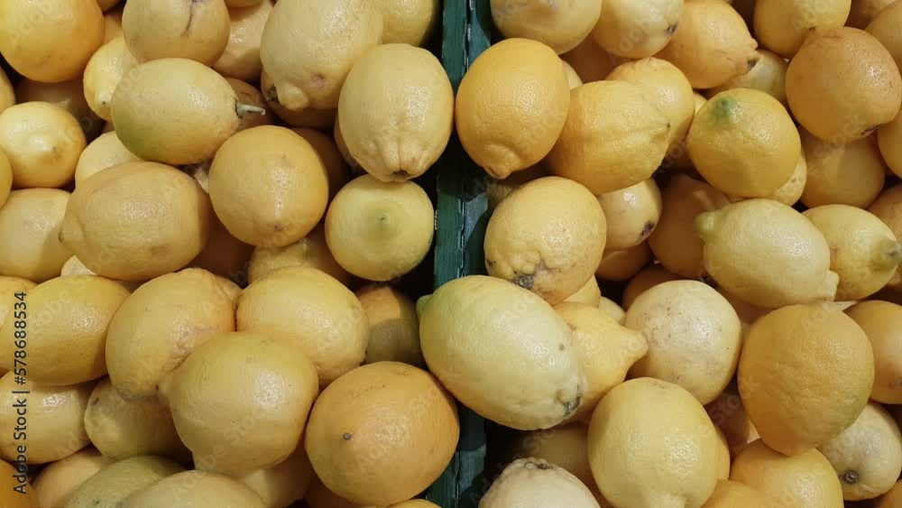 Bunch of fresh yellow Sicilian lemons displayed for sale Bunch of fresh yellow Sicilian lemons displayed for sale