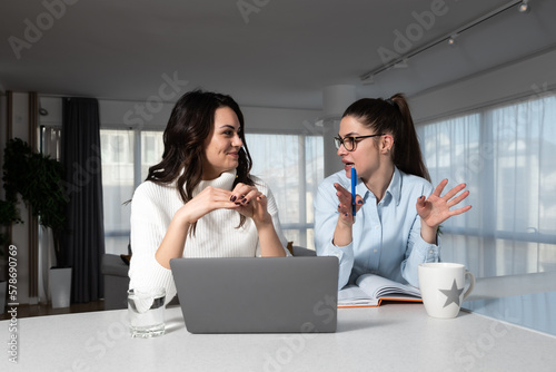 Slika na platnu Two female friends business partners owners of small interior decoration and des