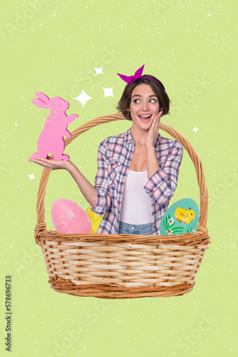 Funny curious girl look at big pink easter chocolate bunny stand into holiday basket among decorated eggs low shopping price proposition
