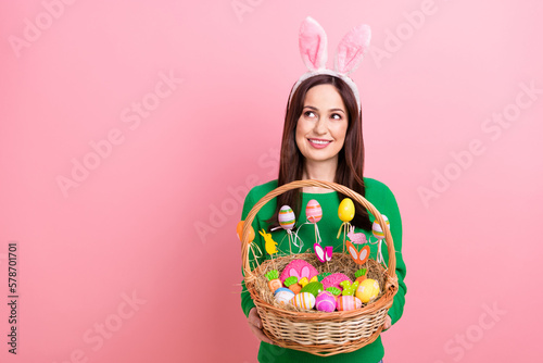 Photography Photo of pretty cheerful person hands hold festive easter basket painted eggs co