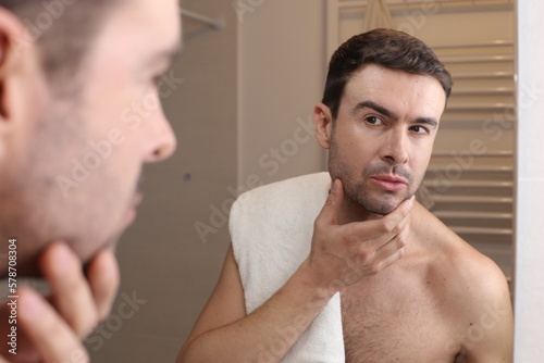 Man feeling overconfident in the bathroom photo