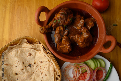 Saoji or savji chicken is a popular Indian food consists of poultry meat, served with chapati ,rice, salad  photo