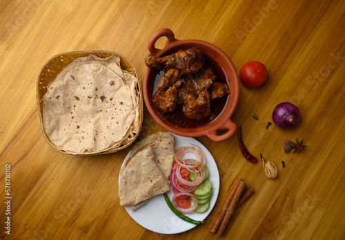 Saoji or savji chicken is a popular Indian food consists of poultry meat, served with chapati ,rice, salad 