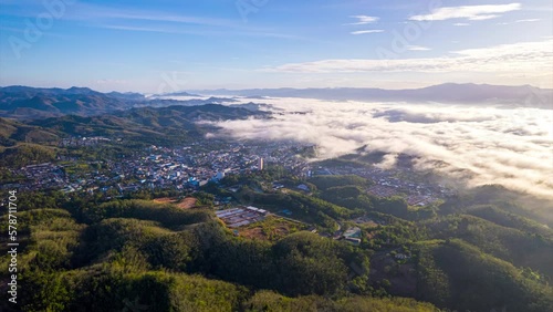 Aerial fly drone hyperlapse foggy or the clouds while sunrise sky on the city, sea of mist mount nature.