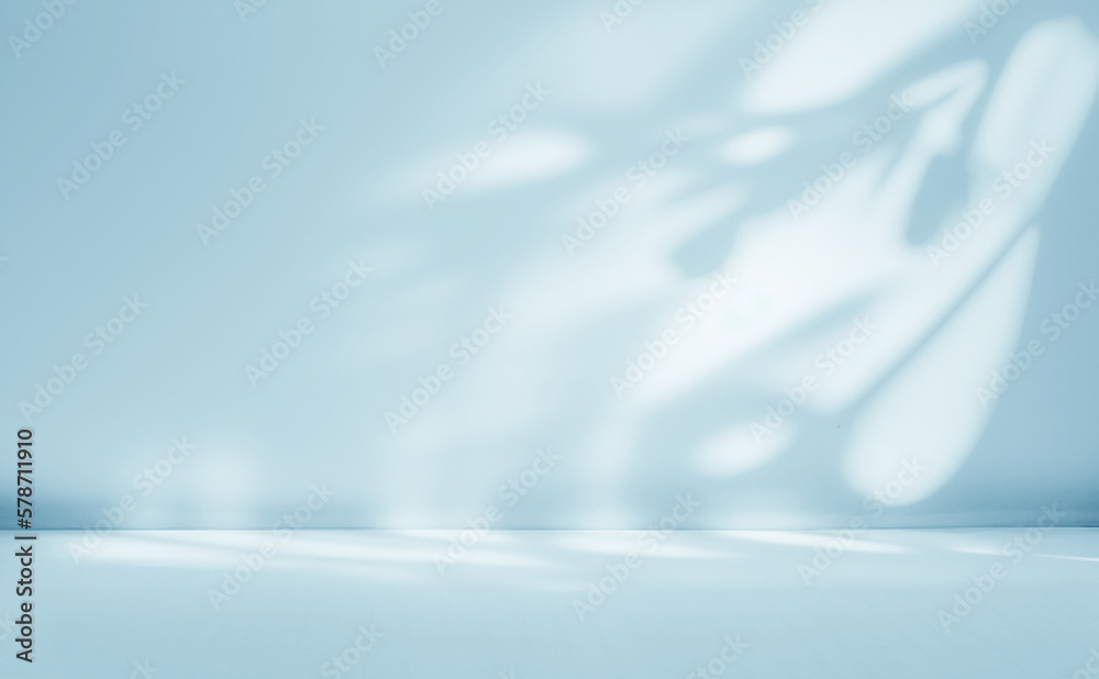 Minimalistic abstract gentle light blue background for product presentation with light and intricate shadow from tree branches on wall. - obrazy, fototapety, plakaty 