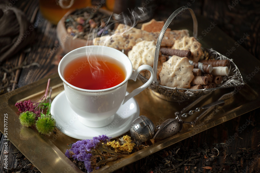 Dry tea leaves in a spoon on an old background Dry tea leaves in a spoon on an old background