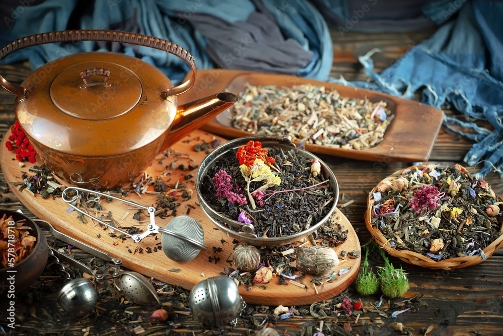 Dry tea leaves in a spoon on an old background Dry tea leaves in a spoon on an old background