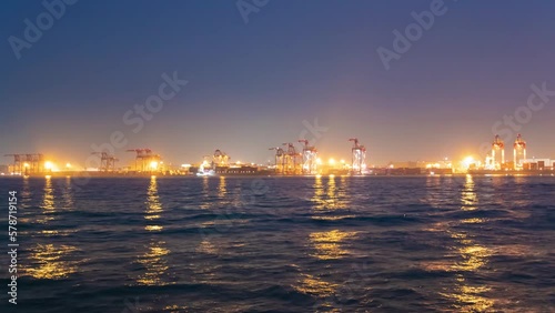 A dusk timelapse of cityscape near the container port in Tokyo photo