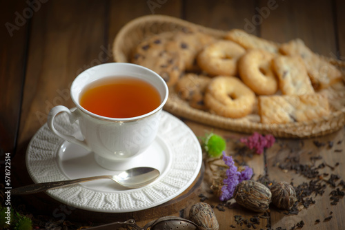Sweet, hot tea with dessert, on an old background.