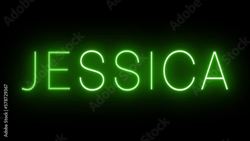 Flickering green retro style neon sign glowing against a black background