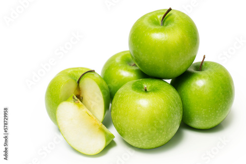 Green apples stacked isolated on white background