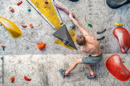 bouldering on an artificial climbing wall