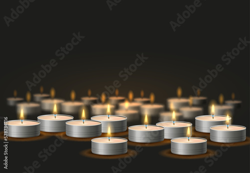 Lots of candles in metal cases. Composition of burning candles on dark background.