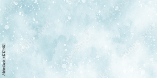 Abstract light blur defocused blue background with bokeh, Beautiful winter background of snow floating into air randomly, light blue bokeh background for wallpaper, invitation, cover and design. 