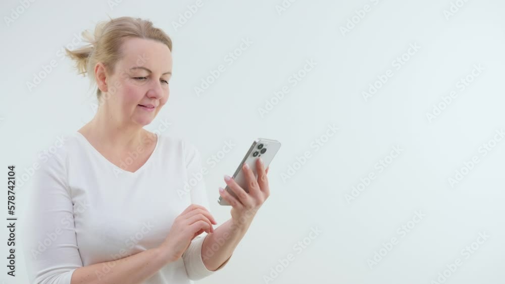 housewife dancing in hands with phone nice music good news watching funny video smile touching finger phone touchpad space for text ad relax celebration housewife dancing in hands with phone nice music good news watching funny video smile touching finger phone touchpad space for text ad relax celebration