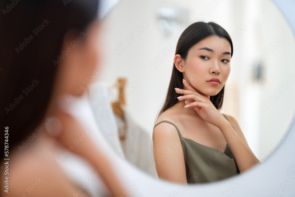 woman looking at mirror woman looking at mirror