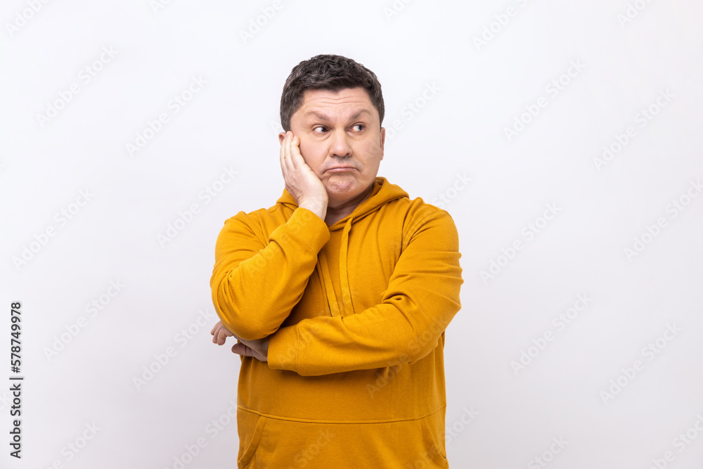 Man contemplating leaning head on hand, pondering difficult question, trying to make right choice. Man contemplating leaning head on hand, pondering difficult question, trying to make right choice.