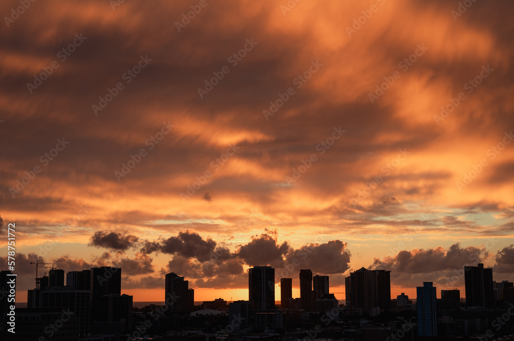 Cityscape Silhouetted with a Red Sunset Overhead.