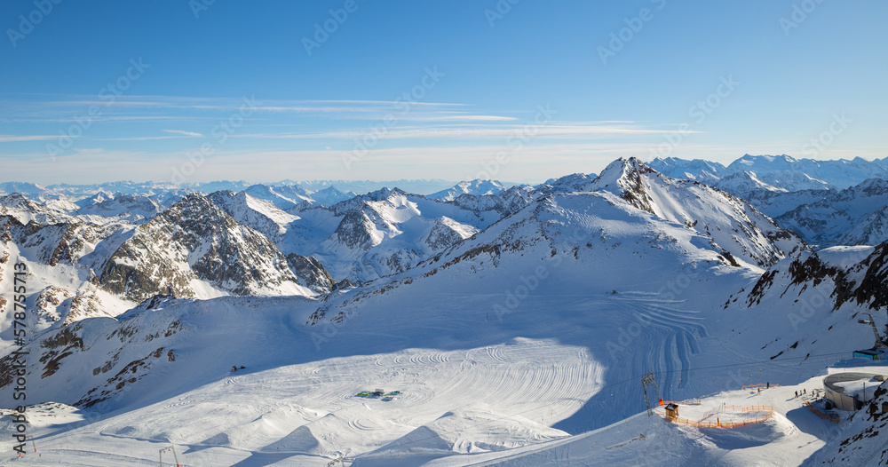 Panoramic view of Alps mountain snowy range with skiing trails, Stubai Glacier, Austria Panoramic view of Alps mountain snowy range with skiing trails, Stubai Glacier, Austria