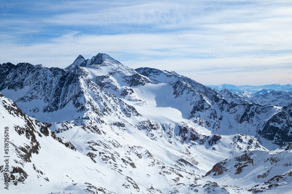 Panoramic view of Alps mountain snowy range with skiing trails, Stubai Glacier, Austria