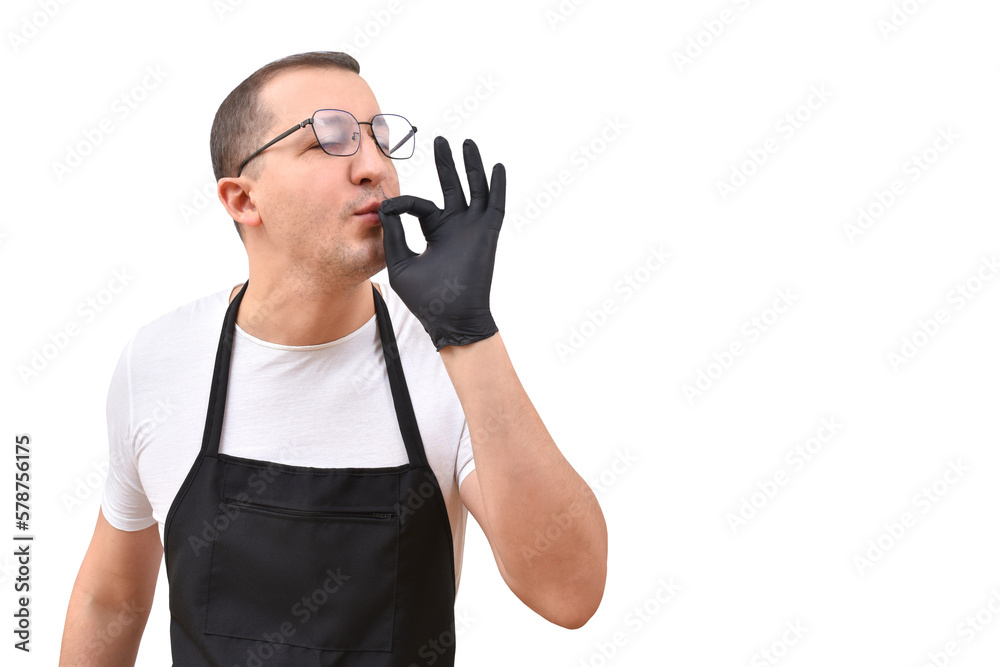 Naklejka premium Professional chef in an apron gesturing with his hands on a white background. The concept of cooking
