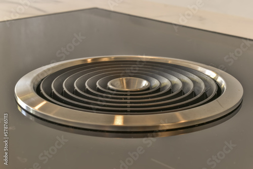 Modern electric induction cooker with extractor hood photo