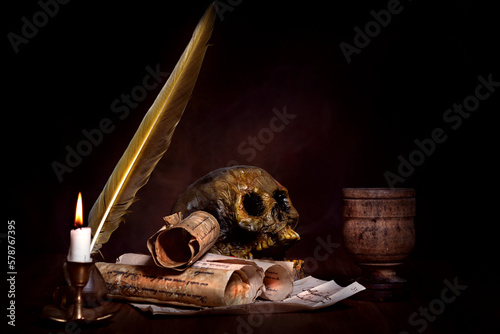 Valokuva medieval occult still life with skull and candle