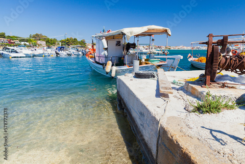 Seaside view with boats and rusty winch. Zakynthos  Greece