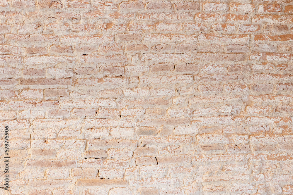 Background texture of old vintage dirty brick wall with white stains. Full frame