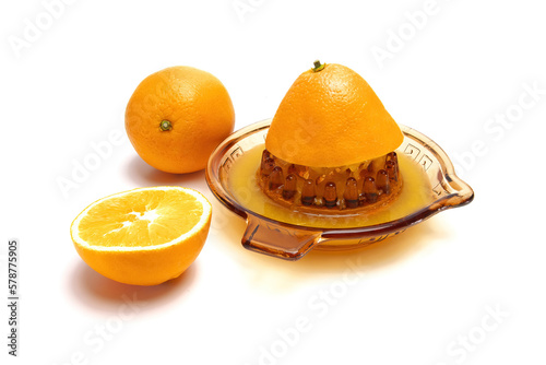 simple glass juicer for citrus fruits, oranges isolated on white