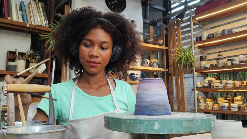 People Creating Pottery in Studio. Female artisan creating handmade ceramics in pottery workshop