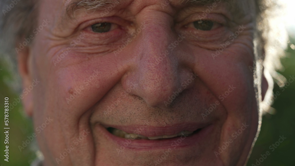 One happy older person Macro close up of a wrinkled senior man eyes looking at camera outside One happy older person Macro close up of a wrinkled senior man eyes looking at camera outside