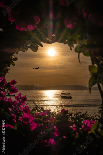 Beautiful sunset in Chapala, Guadalajara with a boat in the middle of the sea
