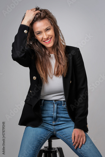 Attractive long haired woman woman studio portrait against isolated background